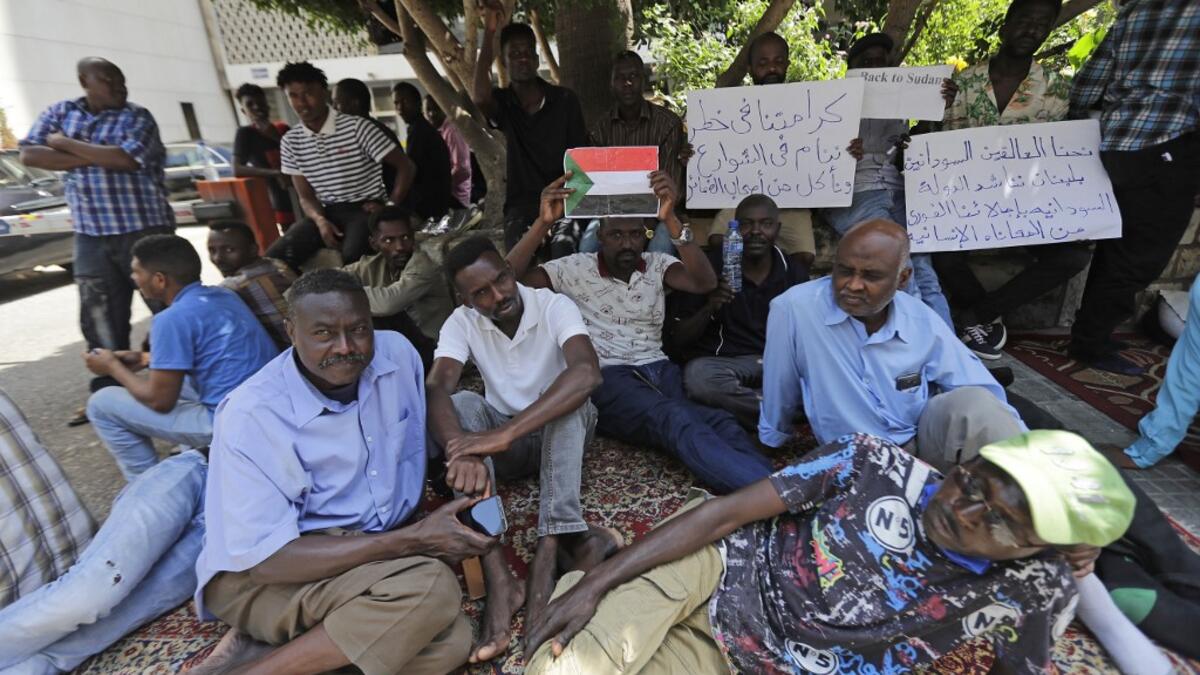Sudanese workers, who lost their jobs due to the deteriorating economic situation in Lebanon, protest outside their county's embassy in Beirut to demand repatriation, on July 2, 2020. JOSEPH EID / AFP
