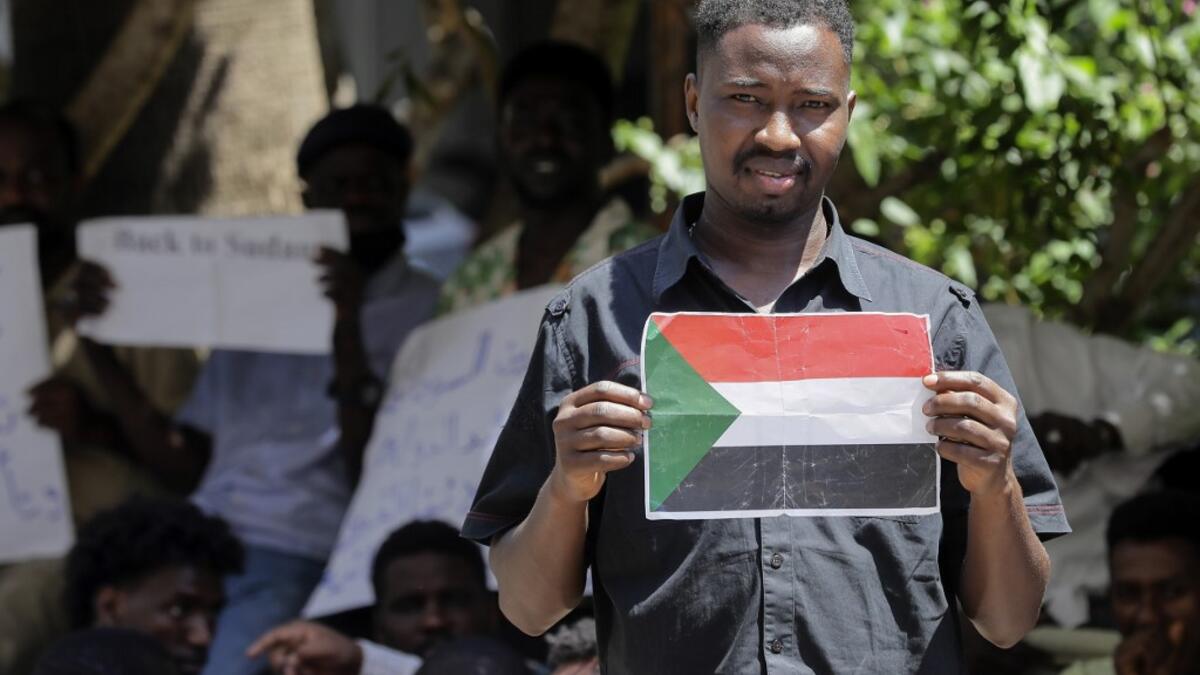Sudanese workers, who lost their jobs due to the deteriorating economic situation in Lebanon, protest outside their county's embassy in Beirut to demand repatriation, on July 2, 2020. JOSEPH EID / AFP
