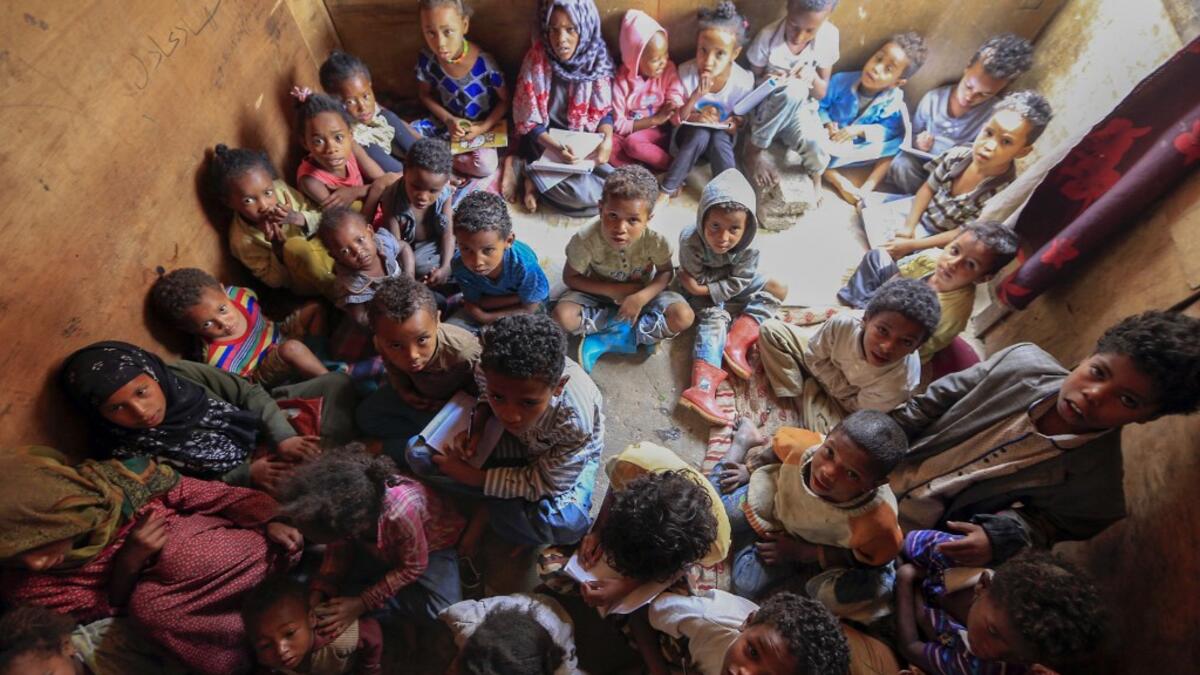Members of Yemen's minority group known as "Muhamasheen" -- literally the "Marginalised" are pictured at a slum in the capital Sanaa on July 4, 2020. At a time when the Black Lives Matter movement is reshaping societies, black Yemenis have scant hope for an end to centuries of discrimination that has only worsened during the civil war. In Sanaa, members of the minority group known as "Muhamasheen" live in dismal conditions in densely populated slums. They count among the poorest of the poor in the Arab worl