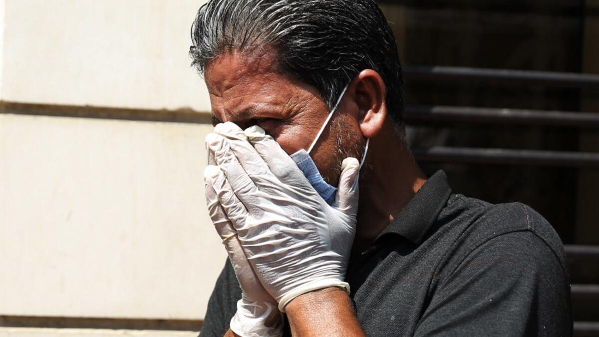 A mourner cries during the funeral of slain Iraqi jihadism expert Hisham al-Hashemi, who was shot dead yesterday outside his house in the Iraqi capital, in Baghdad’s Zayouna district on July 7, 2020. Hashemi was an authoritative voice on Sunni jihadist factions including the Islamic State group, but was also frequently consulted by media and foreign governments on domestic Iraqi politics and Shiite armed groups. He had warm ties with top decision-makers, including President Barham Saleh.