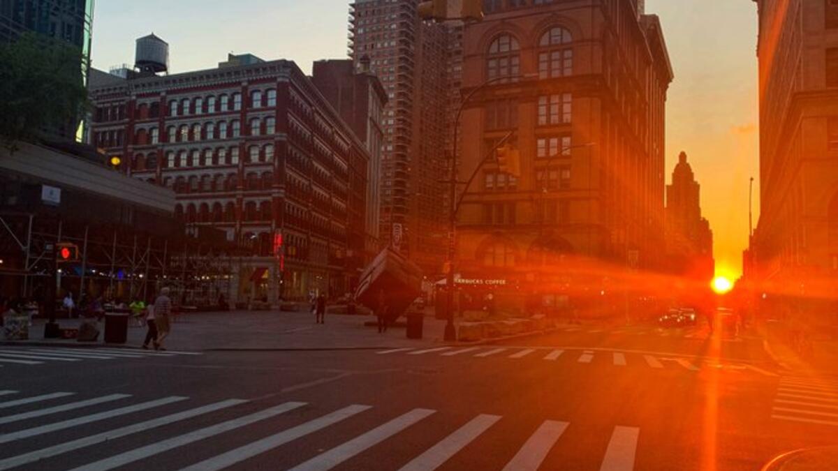 Manhattanhenge happens four times a year, when the sun rises or sets parallel to the street grid in Manhattan (Twitter)