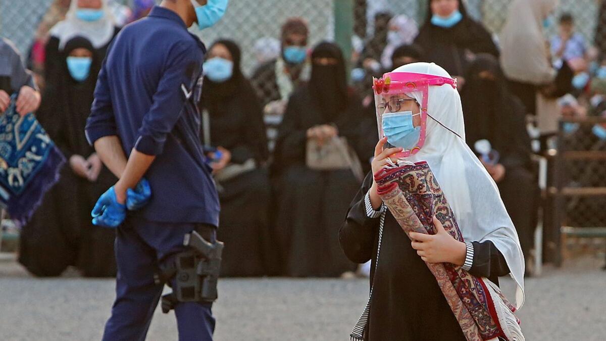 Muslims worshippers perform prayers at a stadium in Bayan district in Kuwait City on July 31, 2020 on the first day of Eid al-Adha. Eid al-Adha (the Festival of Sacrifice) is celebrated throughout the Muslim world as a commemoration of Abraham's willingness to sacrifice his son for God, and cows, camels, goats and sheep are traditionally slaughtered on the holiest day YASSER AL-ZAYYAT / AFP