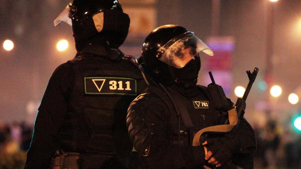 Riot police block an area during a protest of opposition supporters after polls closed in Belarus' presidential election, in Minsk on August 9, 2020. Siarhei LESKIEC / AFP