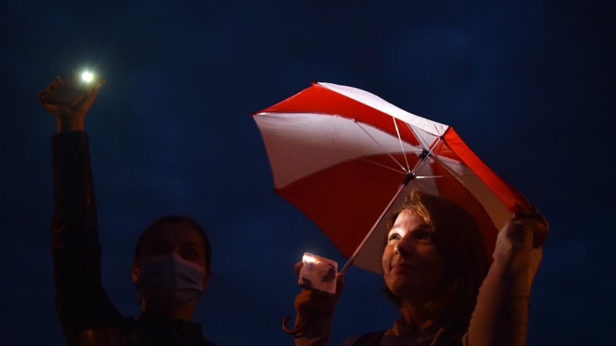 Opposition supporters rally to protest against disputed presidential elections results on Independence Square in Minsk on August 20, 2020. Sergei GAPON / AFP