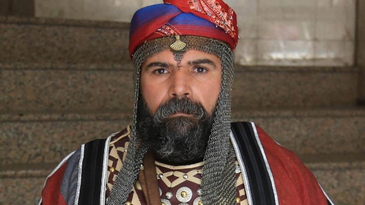 An Ashura re-enactor poses for a picture while dressed in costume as Shiite Muslims prepare to re-enact events of Ashura in the central Iraqi holy shrine city of Karbala on August 22, 2020. Ashura is a period of mourning in remembrance of the seventh-century martyrdom of Prophet Mohammad's grandson Imam Hussein, who was killed in the battle of Karbala in modern-day Iraq, in 680 AD. Mohammed SAWAF / AFP