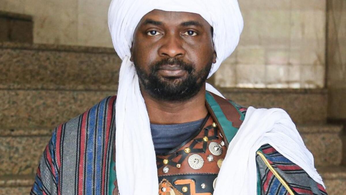 An Ashura re-enactor poses for a picture while dressed in costume as Shiite Muslims prepare to re-enact events of Ashura in the central Iraqi holy shrine city of Karbala on August 22, 2020. Ashura is a period of mourning in remembrance of the seventh-century martyrdom of Prophet Mohammad's grandson Imam Hussein, who was killed in the battle of Karbala in modern-day Iraq, in 680 AD. Mohammed SAWAF / AFP