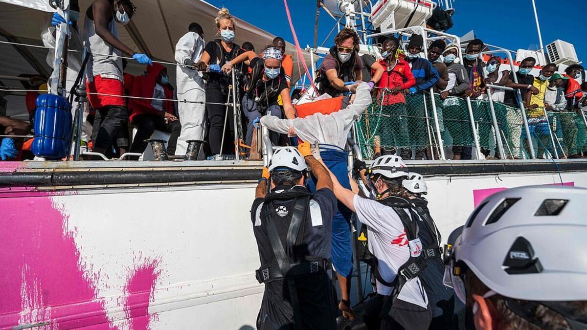 On Wednesday, 45 people – including five children – died when the engine on their boat exploded off the coast of Libya. A migrant being lowered onto Sea-Watch 4 (AFP)