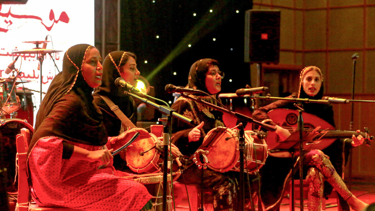 Members of the Iranian all-women music band "Dingo" (L to R) Malihe Shahinzadeh, Negin Heydari, Faezeh Mohseni, and Noushin Yousefzadeh perform together at a concert during the state-organised "Persian Gulf music" festival at Avini Hall in Iran's southern Gulf port city of Bandar Abbas on April 29, 2019. ATTA KENARE / AFP