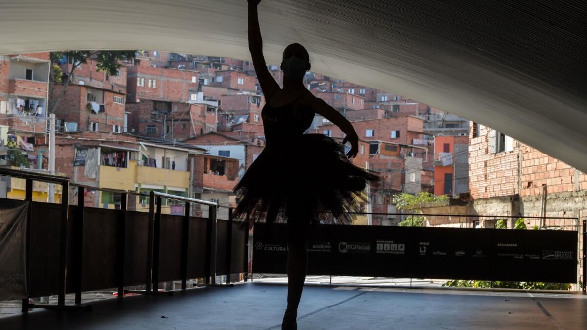Kemilly Luanda, student of the Ballet Paraisopolis, poses during a rehearse in Paraisopolis favela, outskirts of Sao Paulo, Brazil on August 27, 2020, amid the new coronavirus COVID-19 pandemic. NELSON ALMEIDA / AFP