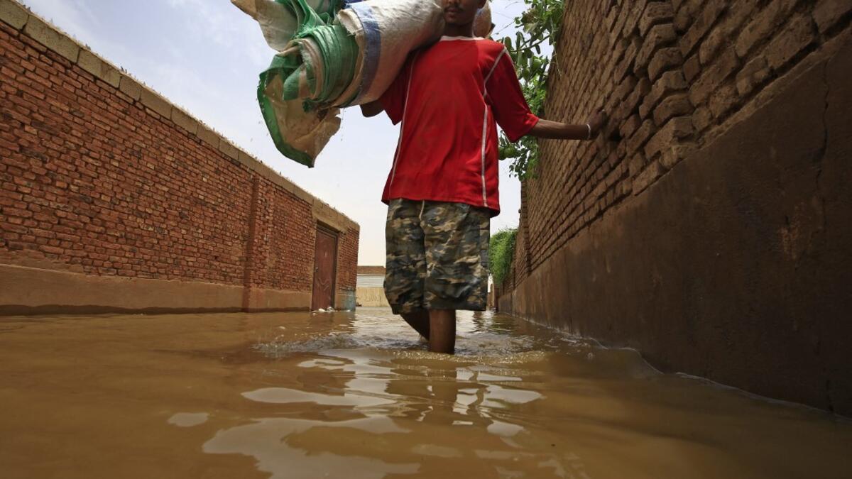 Officials say that across Sudan seasonal floods have killed 94 people, injured 46 and destroyed or damaged over 60,000 homes, with the river level rising to 17.43 metres (57 feet feet). ASHRAF SHAZLY / AFP