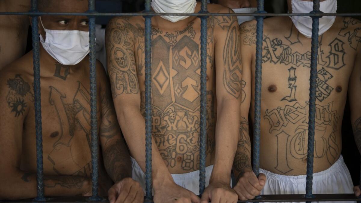 Gang members remain in an overcrowded cell at the Quezaltepeque prison, in Quezaltepeque, El Salvador, on September 4, 2020. Authorities from the General Directorate of Penal Centres (DGCP) visited three Salvadorean prisons, some of maximum security, to check the situation of inmates and carry out searches amid the COVID-19 novel coronavirus pandemic. Yuri CORTEZ / AFP