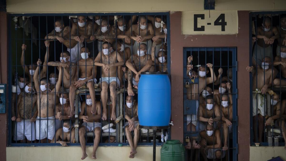 Members of the MS-13 and 18 gangs remain in an overcrowded cell at the Quezaltepeque prison, in Quezaltepeque, El Salvador, on September 4, 2020. Authorities from the General Directorate of Penal Centres (DGCP) visited three Salvadorean prisons, some of maximum security, to check the situation of inmates and carry out searches amid the COVID-19 novel coronavirus pandemic. Yuri CORTEZ / AFP
