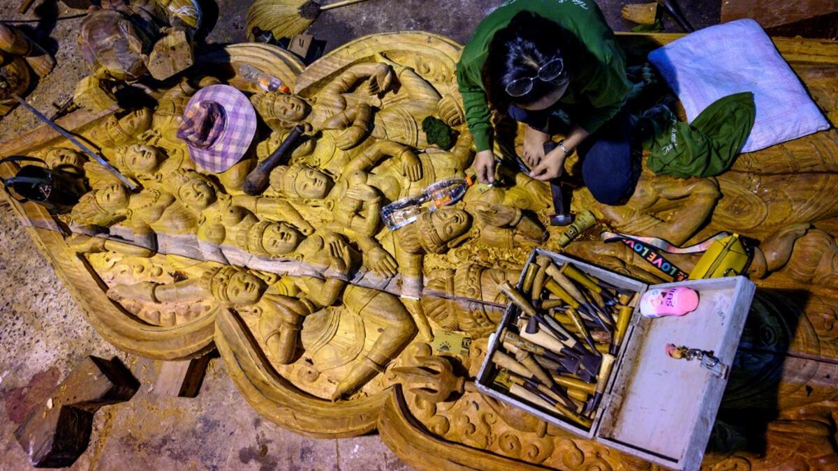 The building was designed by Thai businessman Lek Viriyaphan and is decorated with ornamentation from the Thai, Hindu, Buddhist, Chinese, and Khmer traditions. The construction started in 1981 and is not expected to be finished until 2025. Mladen ANTONOV / AFP