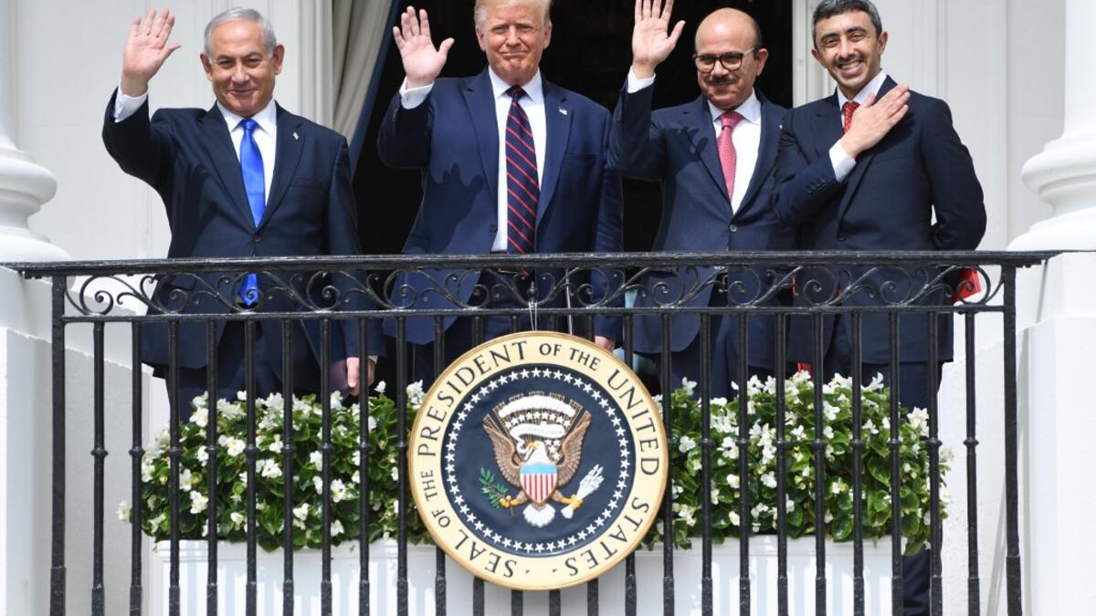 (L-R) Israeli Prime Minister Benjamin Netanyahu, US President Donald Trump, Bahrain Foreign Minister Abdullatif al-Zayani, and UAE Foreign Minister Abdullah bin Zayed Al-Nahyan wave from the Truman Balcony at the White House after they participated in the signing of the Abraham Accords where the countries of Bahrain and the United Arab Emirates recognize Israel, in Washington, DC, September 15, 2020.