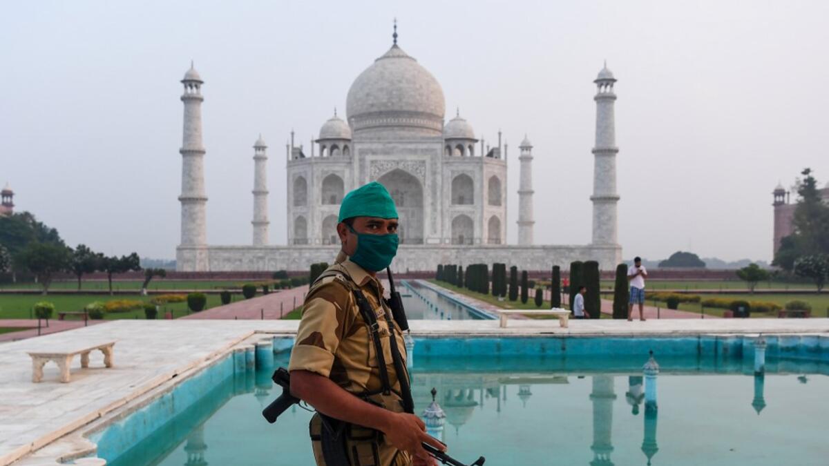 A security personnel patrols at the Taj Mahal in Agra on September 21, 2020. The Taj Mahal reopened to visitors on September 21 in a symbolic business-as-usual gesture even as India looks set to overtake the US as the global leader in coronavirus infections. Sajjad HUSSAIN / AFP