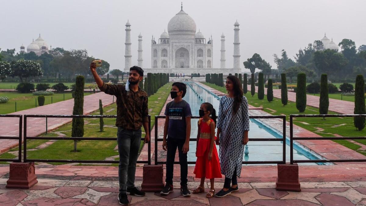 Tourists visit the Taj Mahal in Agra on September 21, 2020. The Taj Mahal reopened to visitors on September 21 in a symbolic business-as-usual gesture even as India looks set to overtake the US as the global leader in coronavirus infections. Sajjad HUSSAIN / AFP