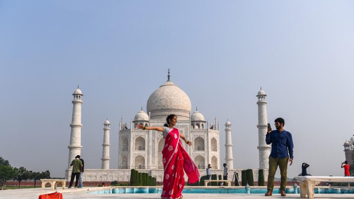 Tourists visit the Taj Mahal in Agra on September 21, 2020. The Taj Mahal reopened to visitors on September 21 in a symbolic business-as-usual gesture even as India looks set to overtake the US as the global leader in coronavirus infections. Sajjad HUSSAIN / AFP