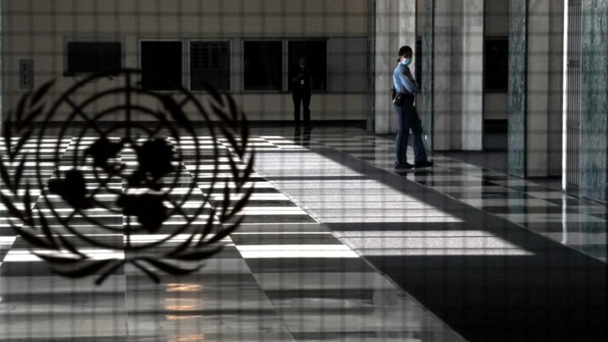 A UN police officer stands at an empty entrance at the United Nations September 22, 2020 during the 75th General Assembly of the United Nations which is mostly virtual due to the covid-19 pandemic in New York. UN Secretary-General Antonio Guterres urged the world to prevent a Cold War between the United States and China and halt conflicts so it can focus on the covid-19 pandemic. TIMOTHY A. CLARY / AFP