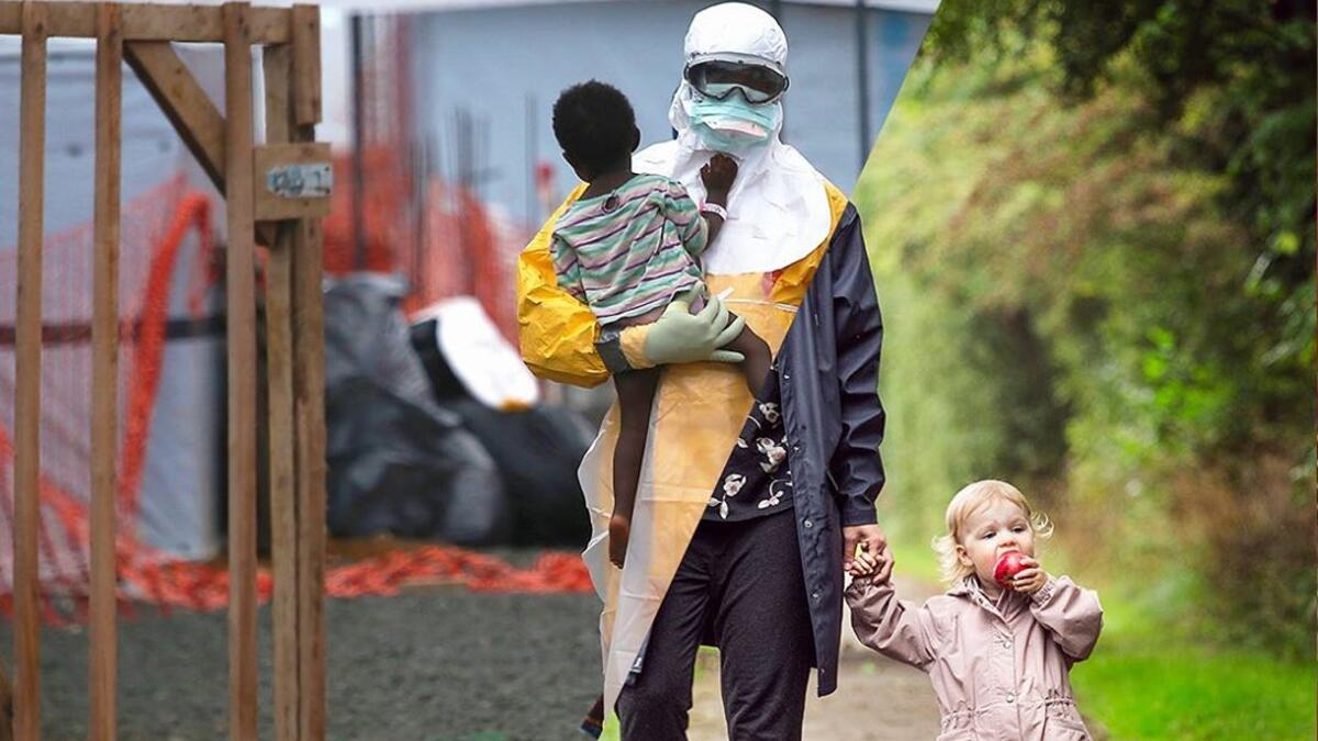 A Doctors Without Borders (MSF), health worker in protective clothing carries a child suspected of having Ebola in the MSF treatment center on October 5, 2014 in Paynesville, Liberia. The girl and her mother, showing symptoms of the deadly disease, were awaiting test results for the virus. The Ebola epidemic has killed more than 3,400 people in West Africa, according to the World Health Organization.  (ugurgallen/ Instagram)