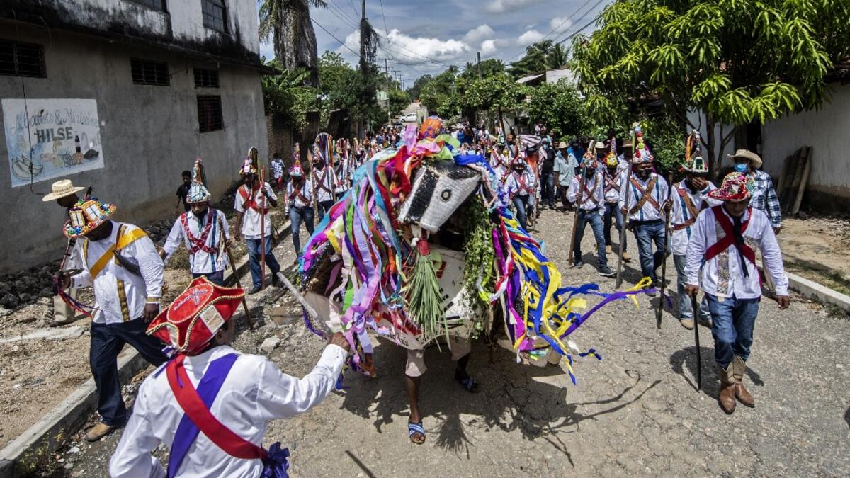 Members of the Afro-Mexican community take part in the annual festival dedicated to San Nicolas Tolentino, in Cuajinicuilapa, Guerrero state, Mexico, on September 10, 2020, amid the COVID-19 coronavirus pandemic. Although there are 1,5 million African descendants in a country of 128 million inhabitants, it is normal to hear that "in Mexico there are no blacks". PEDRO PARDO / AFP