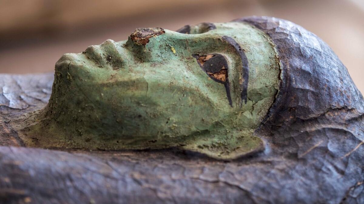 A picture taken on October 3, 2020 shows one of the sarcophaguses, excavated by the Egyptian archaeological mission which resulted in the discovery of a deep burial well with more than 59 human coffins closed for more than 2,500 years, displayed during a press conference at the Saqqara necropolis, 30 kms south of the Egyptian capital Cairo. They were unearthed south of Cairo in the sprawling burial ground of Saqqara, the necropolis of the ancient Egyptian capital of Memphis, a UNESCO World Heritage site. Th