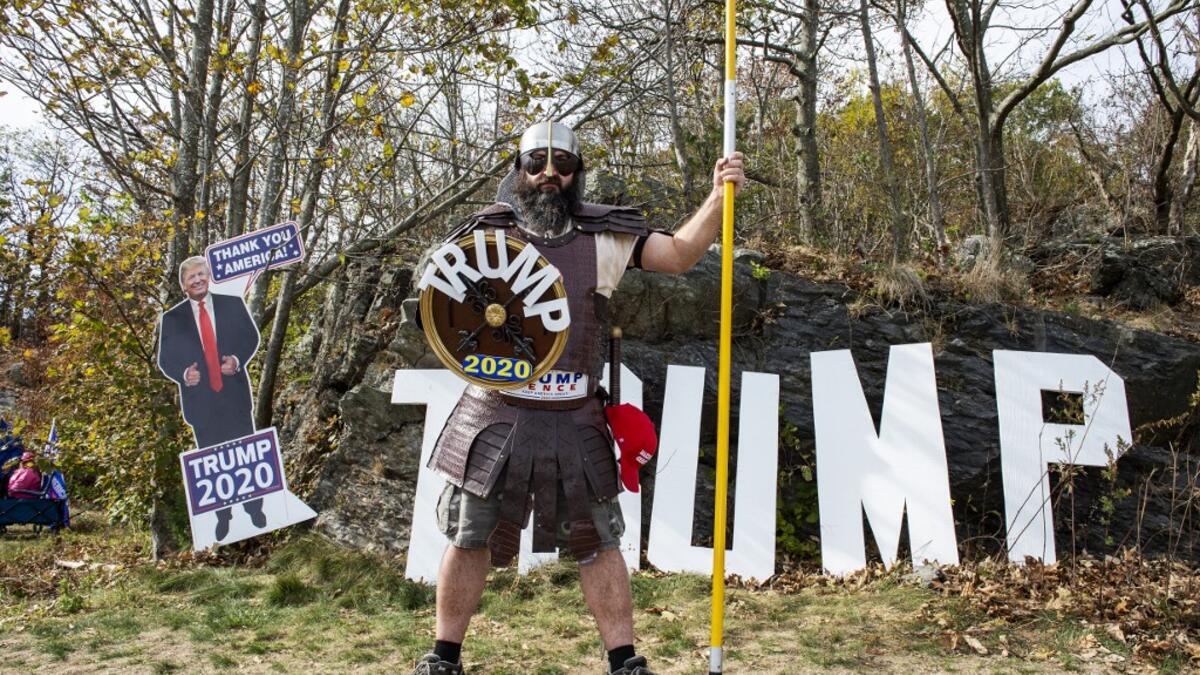 A contestant dressed as a viking version of President Trump poses for a portrait during a Trump campaign rally named "Trumptoberfest" at Rocky Point Park in Warwick, Rhode Island on October 11, 2020. Many supporters dressed in political campaign clothing and waved flags while others dressed in festive costumes to take part in a political costume contest. Joseph Prezioso / AFP