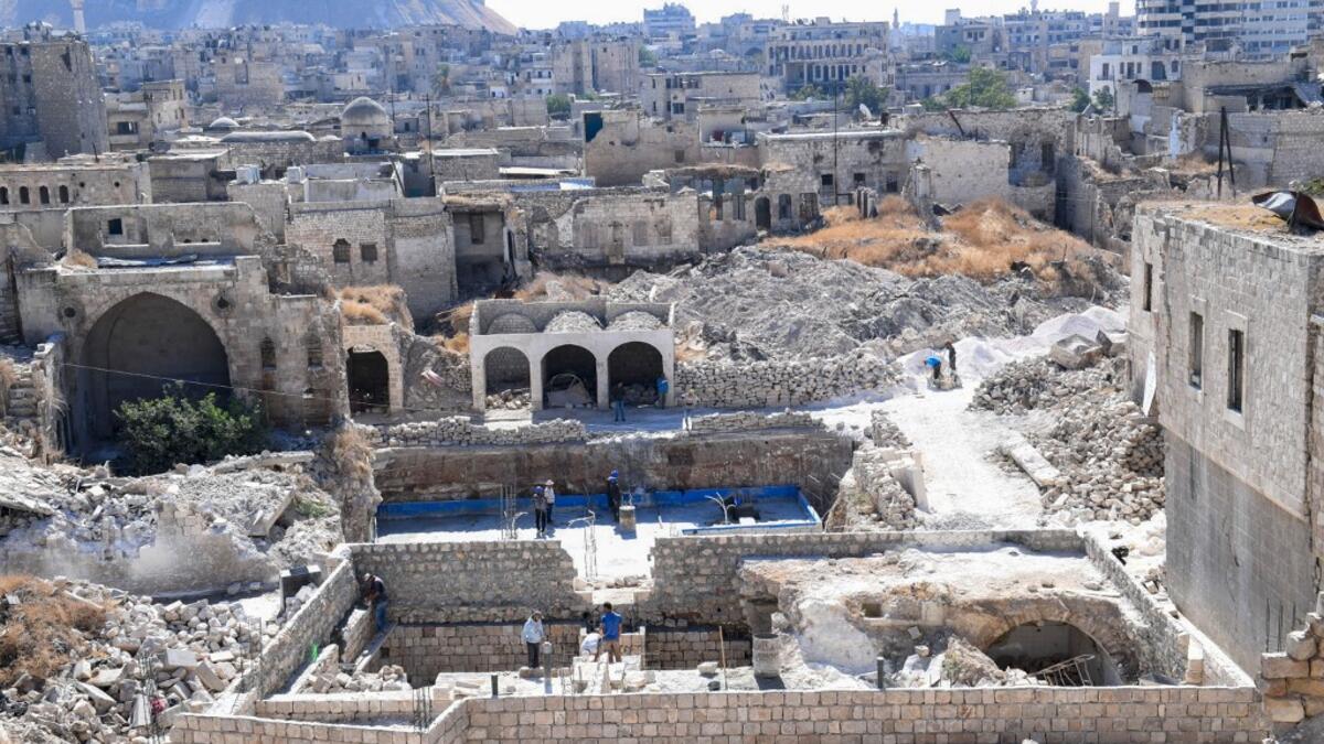 Syrian workers take part in the reconstruction of Martini restaurant and hotel in the Jdaideh neighbourhood in Aleppo's Old City on October 17, 2020. AFP