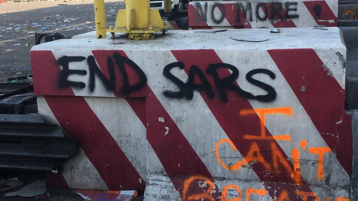 A general view of a deserted toll-gate after10 days of occupation by protesters in Nigeria on October 21, 2020, after the security forces opened fire on a peaceful sit-in protest on October 20, 2020 in which Amnesty International said several people were killed. Witnesses said gunmen opened fire on a crowd of over 1,000 people on the evening of October 20, 2020, to disperse them after a curfew was imposed to end spiraling protests over police brutality and deep-rooted social grievances. SOPHIE BOUILLON / AF