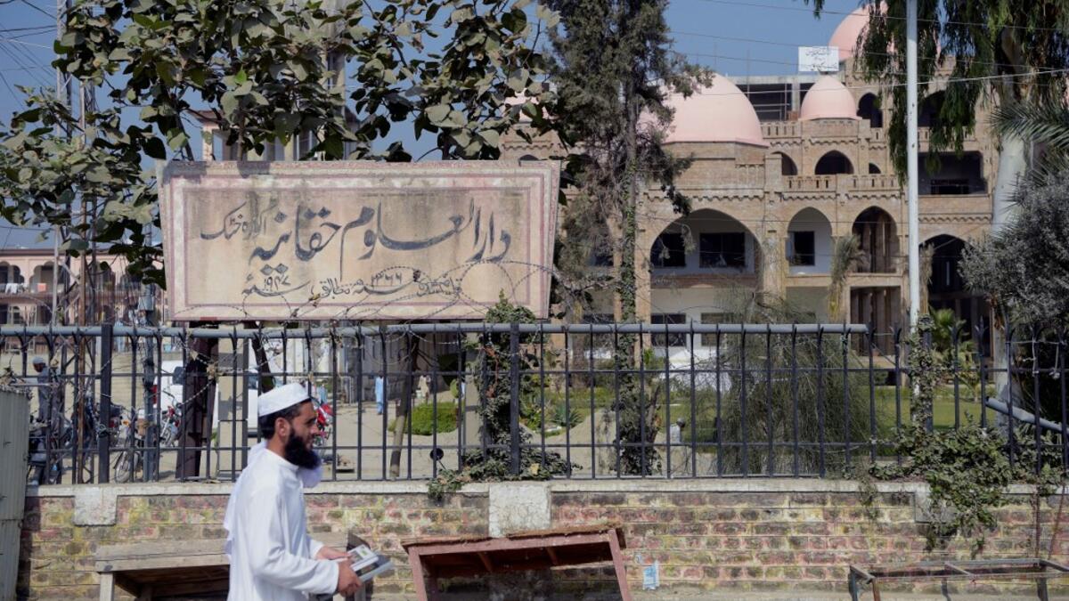 In this picture taken on October 19, 2020 an Islamic seminary student walks outside the Darul Uloom Haqqania seminary in Akora Khattak. The Darul Uloom Haqqania seminary has churned out a who's who of Taliban top brass -- including many now on the hardline group's negotiating team holding talks with the Kabul government to end a 20-year war. Abdul MAJEED / AFP