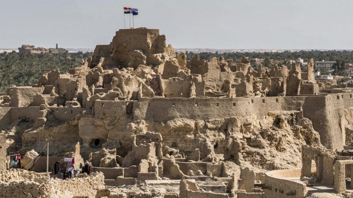 After it was worn away by erosion, and then torrential rains in 1926, the European Union and Egyptian company Environmental Quality International (EQI) from 2018 sought to restore the building, at a cost of over $600,000.  Khaled DESOUKI / AFP