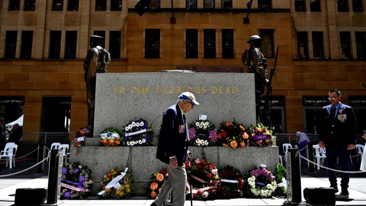 An elderly man walks past The Cenotaph monument after the Remembrance Day Service to mark the anniversary of the end of World War I, at Martin Place in Sydney on November 11, 2020. Saeed KHAN / POOL / AFP