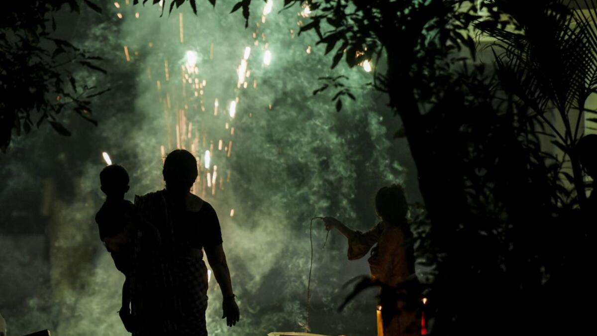 People light firecrackers during Diwali, the Hindu Festival of Lights, in Chennai on November 14, 2020. Arun SANKAR / AFP