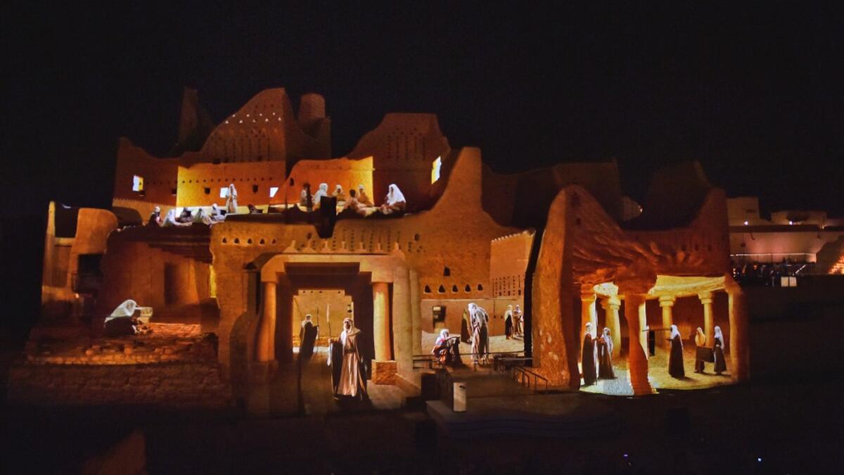 An animation is projected at the historical site of al-Tarif in Diriyah district, on the outskirts of Saudi capital Riyadh, on November 20, 2020. Saudi Arabia hosts the G20 summit on November 21 in a first for an Arab nation, with the downsized virtual forum dominated by efforts to tackle a resurgent coronavirus pandemic and crippling economic crisis. FAYEZ NURELDINE / AFP
