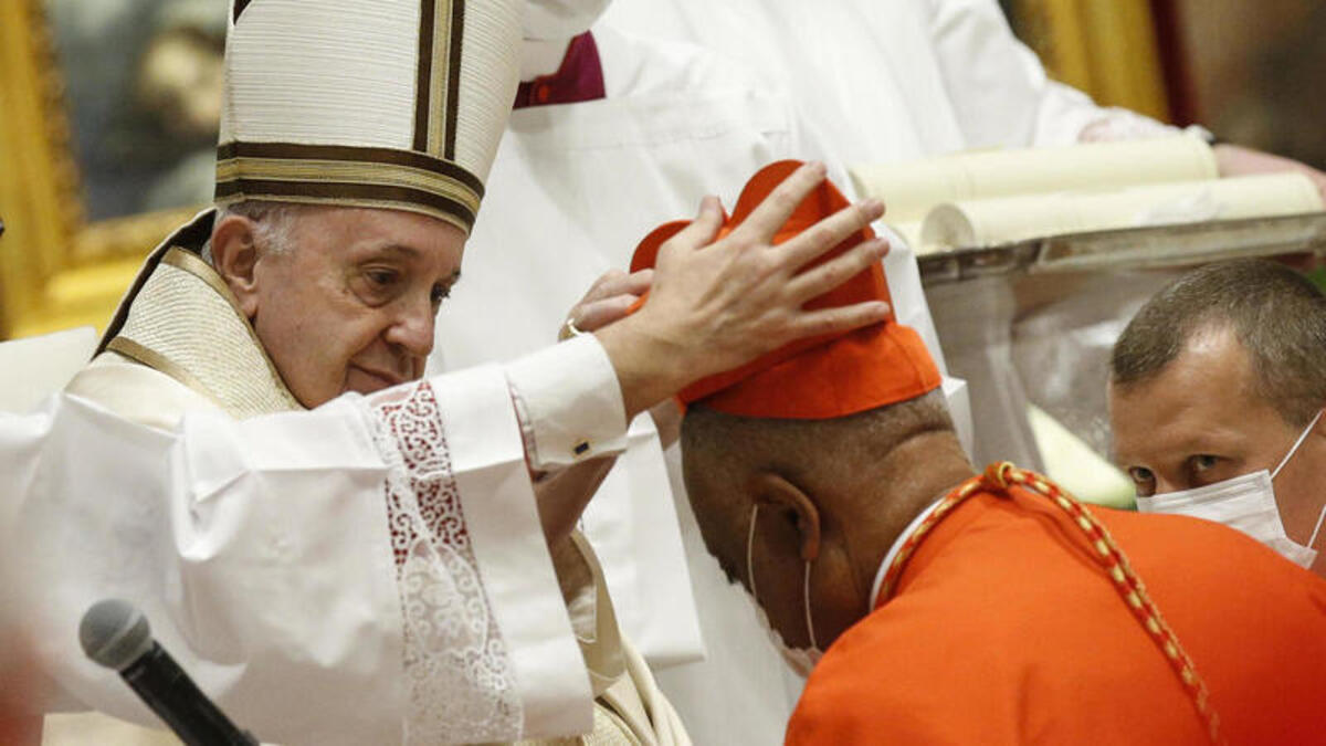 Archbishop Wilton Gregory of Washington, D.C., becomes a cardinal during a ceremony Saturday known as a consistory in St. Peter's Basilica at the Vatican. Pope Francis cautioned new cardinals never to lose their connection to the people. Fabio Frustaci/Pool/AFP via Getty Images