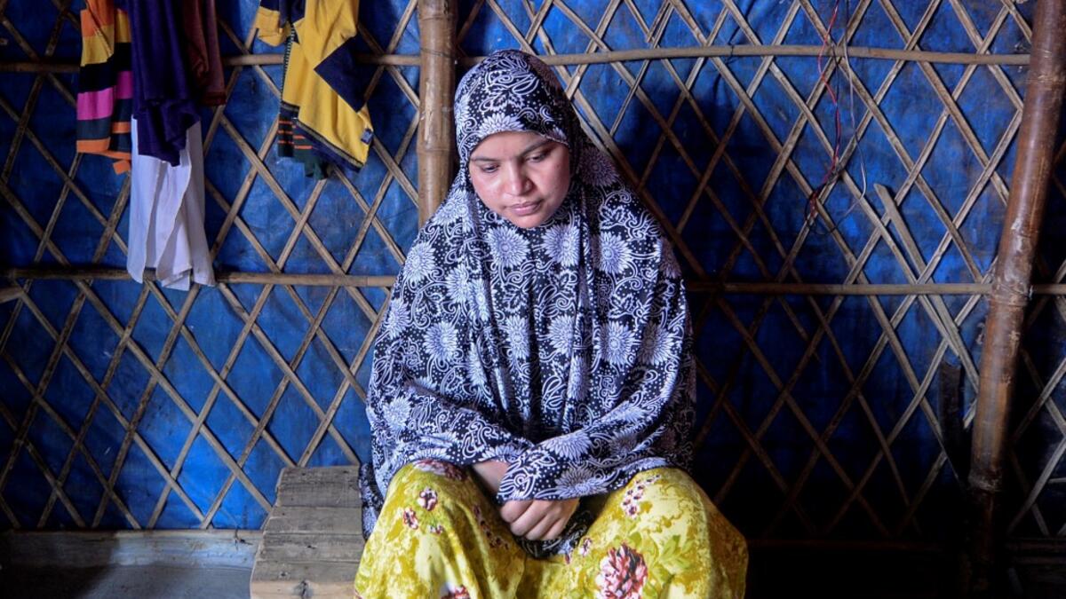 In this photograph taken on August 24, 2020, Rohingya refugee Somuda Begum pauses during an interview with AFP at Kutupalong refugee camp in Ukhia. Stay in a squalid refugee camp -- hopeless, starving, and made to feel a burden -- or leave, risking death, rape, human trafficking and months at sea to reach a husband you've never met. This is the bleak choice many Rohingya women, already scarred from fleeing persecution in Myanmar, are now facing. Munir UZ ZAMAN / AFP