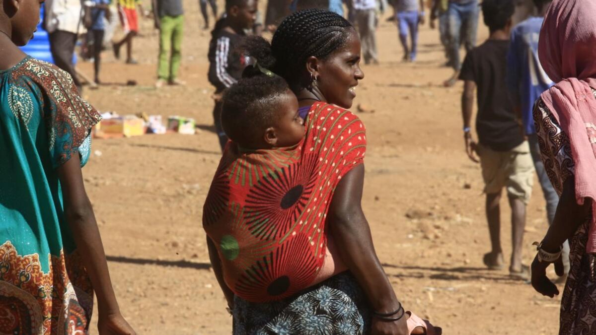 Ethiopian refugees who fled the fighting in Tigray Region are pictured at Umm Rakuba camp in eastern Sudan's Gedaref State, on November 30, 2020. ASHRAF SHAZLY / AFP