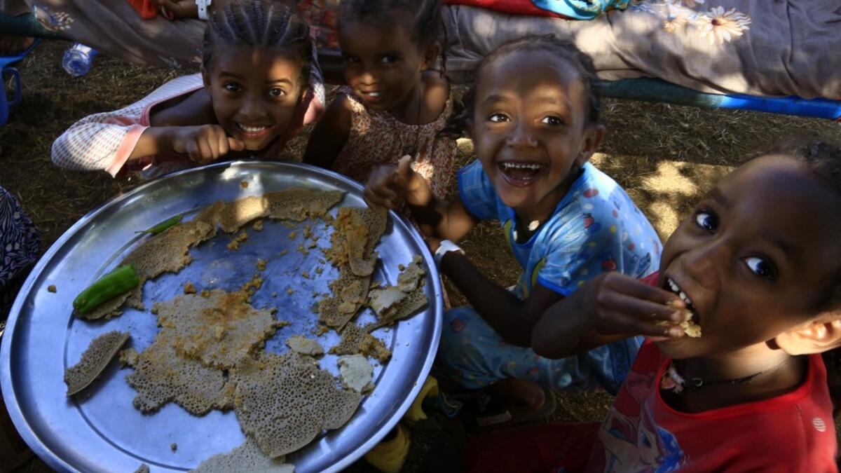 Ethiopia refugees who fled the fighting in Tigray Region are pictured at Umm Rakuba camp in eastern Sudan's Gedaref State, on November 30, 2020. ASHRAF SHAZLY / AFP