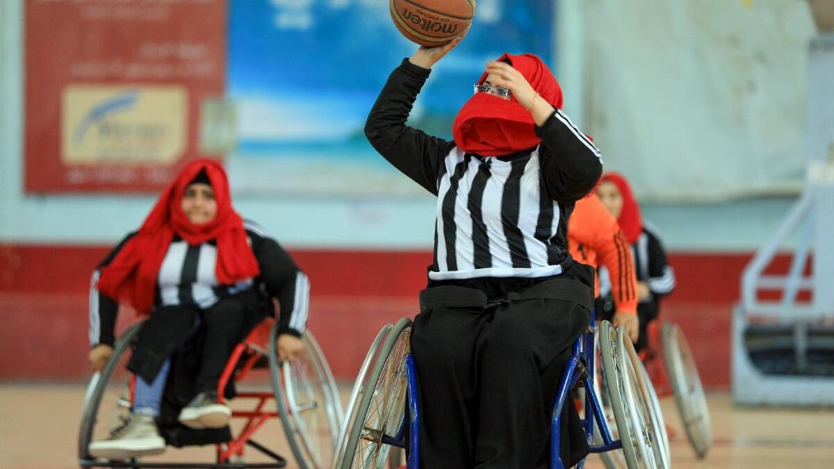 Disabled Yemeni women take part in a local wheelchair basketball championship in Yemen's capital Sanaa on December 8, 2020. In conflict-ridden Yemen, nine teams, including five-all women groups, competed in a local championship for the disabled in the capital Sanaa, which has been under rebel control since 2014. The players are competing to be embraced by society for their strengths rather than be viewed as a burden during the time of war. Mohammed HUWAIS / AFP
