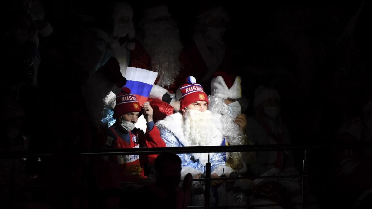 Russia's team fans dressed as Ded Moroz (Santa Claus or Father Frost) watch the Channel One Cup of the Euro Hockey Tour ice hockey match between Russia and Czech Republic at CSKA Arena in Moscow on December 19, 2020. Russia won the game 4-1.  Natalia KOLESNIKOVA / AFP