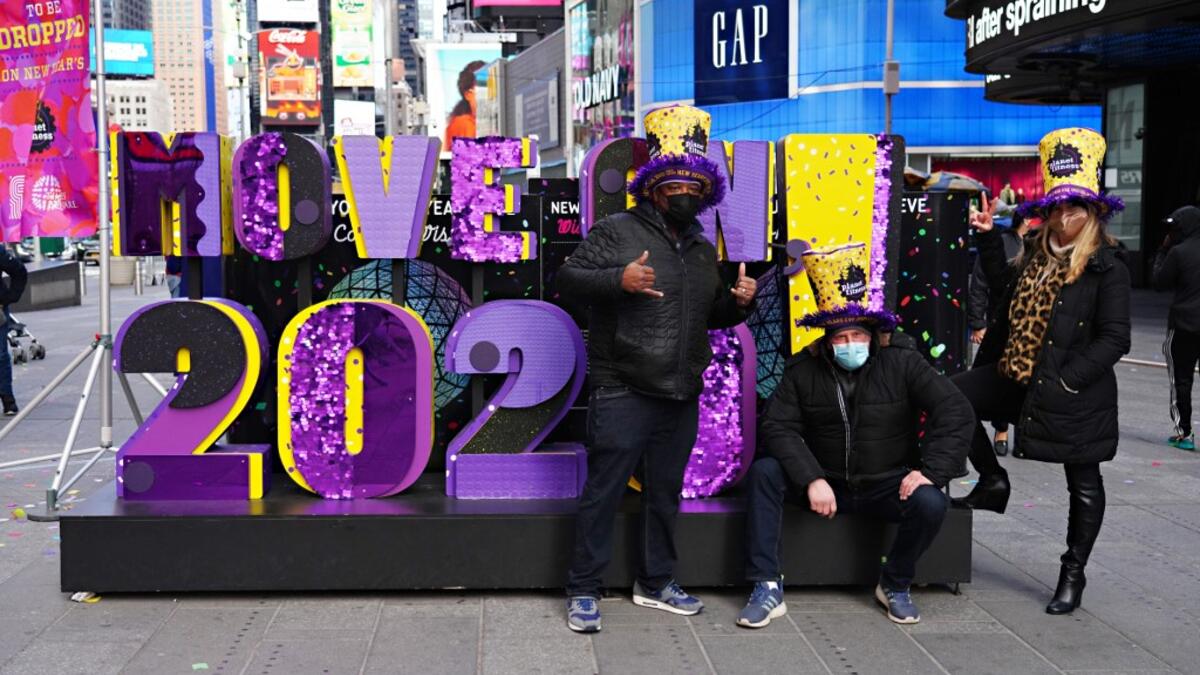 Guests attend as Times Square New Year's Eve co-organizers Times Square Alliance and Countdown Entertainment, along with presenting sponsor Planet Fitness, release multicolored confetti at Hard Rock Cafe Marquee on December 29, 2020 in New York City. Cindy Ord/Getty Images/AFP Cindy Ord / GETTY IMAGES NORTH AMERICA / Getty Images via AFP