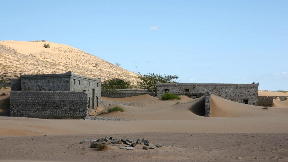 This picture taken on December 31, 2020, shows abandoned houses in the Omani village of Wadi al-Murr, about 400 kms (250 miles) southwest of the capital Muscat. MOHAMMED MAHJOUB / AFP