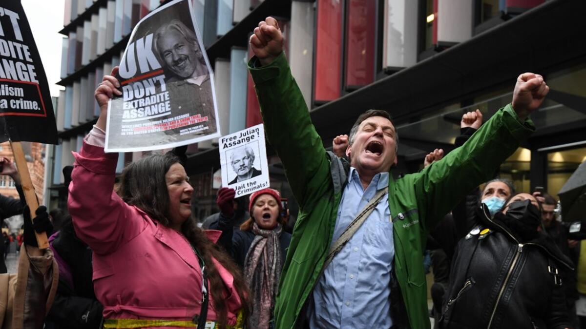 Supporters of Wikileaks founder Julian Assange celebrate outside the Old Bailey court in central London after a judge ruled that Assange should not be extradited to the United States to face espionage charges for publishing secret documents online on January 4, 2021. DANIEL LEAL-OLIVAS / AFP