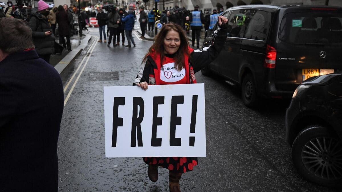 Supporters of Wikileaks founder Julian Assange celebrate outside the Old Bailey court in central London after a judge ruled that Assange should not be extradited to the United States to face espionage charges for publishing secret documents online on January 4, 2021. DANIEL LEAL-OLIVAS / AFP