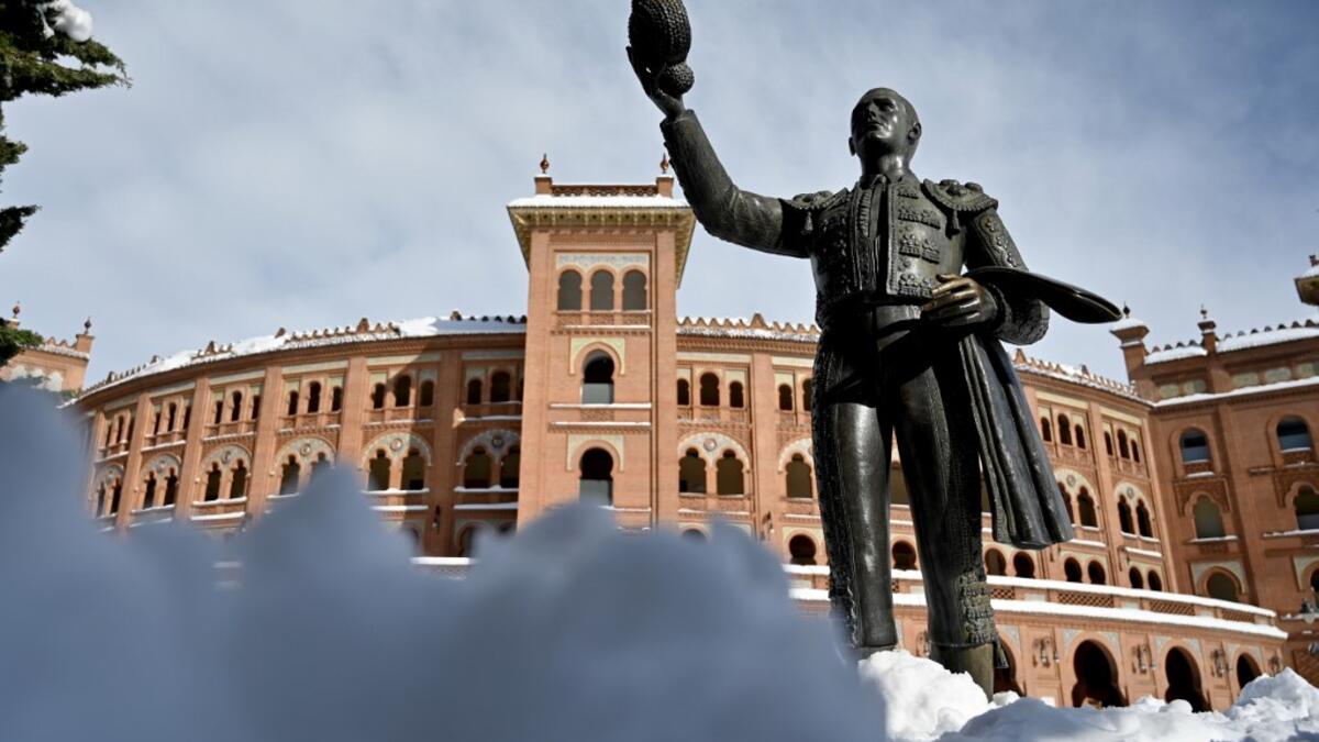 Snow covers the area outside the Las Ventas bullring in Madrid on January 10, 2021. Snowstorms in Spain left three people dead and caused chaos across much of the country, trapping motorists and shutting down the capital's air and rail links. Gabriel BOUYS / AFP