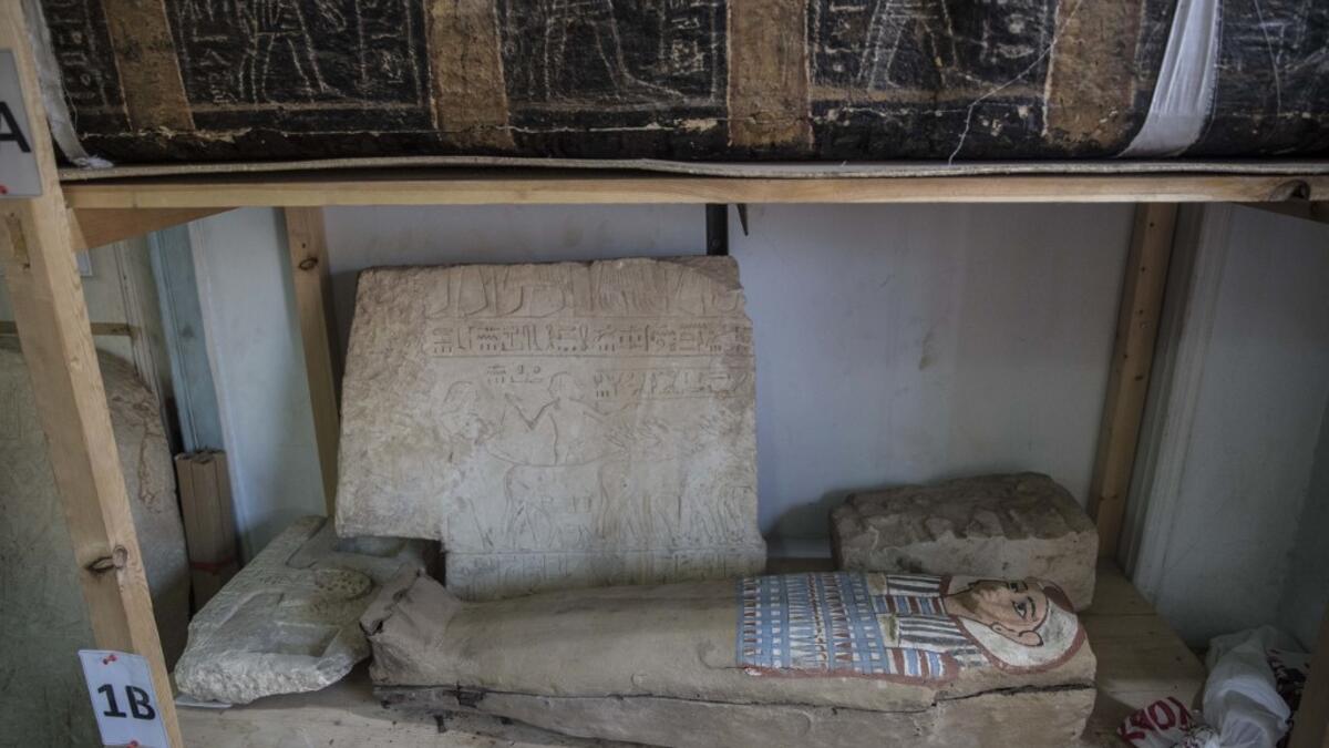 A sarcophagus is displayed during the official announcement of the discovery by an Egyptian archaeological mission of a new trove of treasures at Egypt's Saqqara necropolis south of Cairo, on January 17, 2021. The discovery at the necropolis which lies 30kms south of the Egyptian capital, includes the funerary temple of Queen Naert, wife of King Teti, as well as burial shafts, coffins, and mummies dating back to nearly 3000 years ago during the New Kingdom. Khaled DESOUKI / AFP