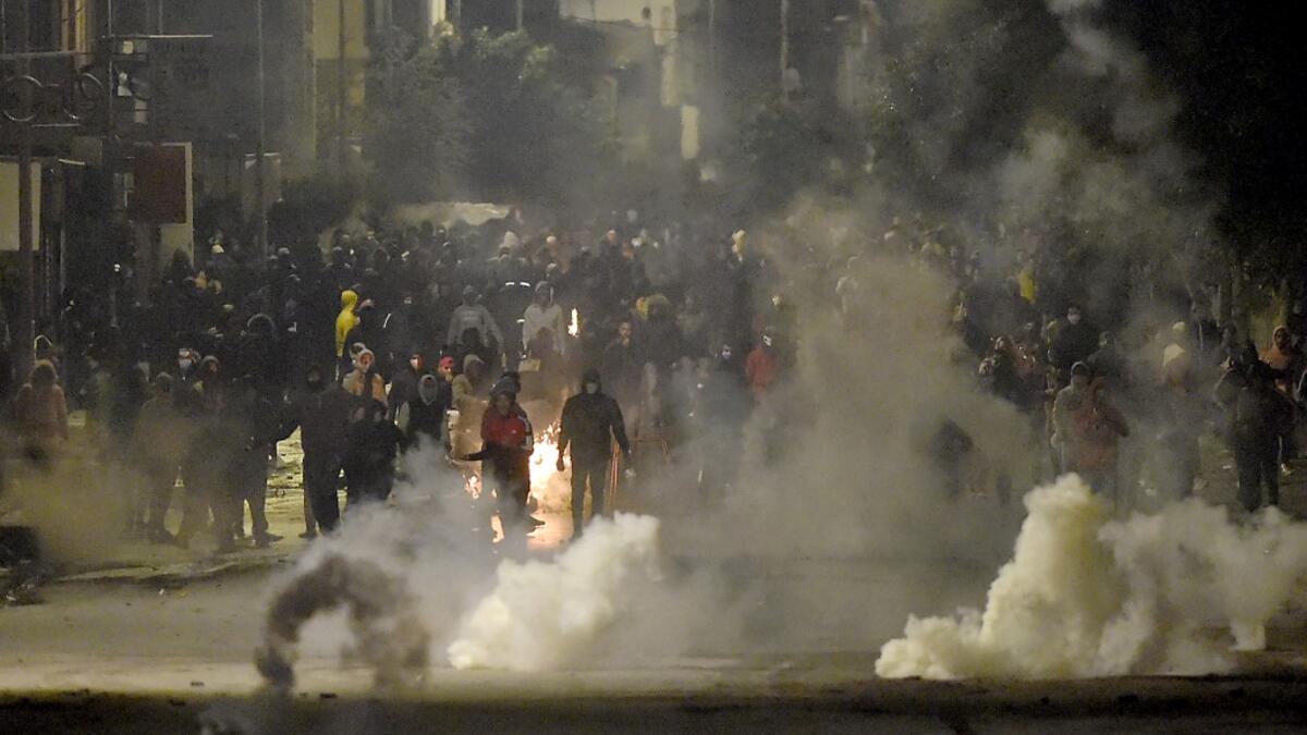 The social unrest comes at a time of economic crisis, worsened by the pandemic, that has sparked rapid inflation and high youth unemployment and led many people to leave the North African country. FETHI BELAID / AFP