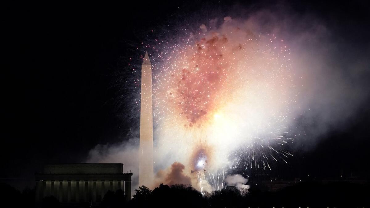 Fireworks display over the National Mall at the conclusion of the "Celebrating America" event at the Lincoln Memorial after the inauguration of Joe Biden as the 46th President of the United States in Washington, DC, January 20, 2021. TIMOTHY A. CLARY / AFP