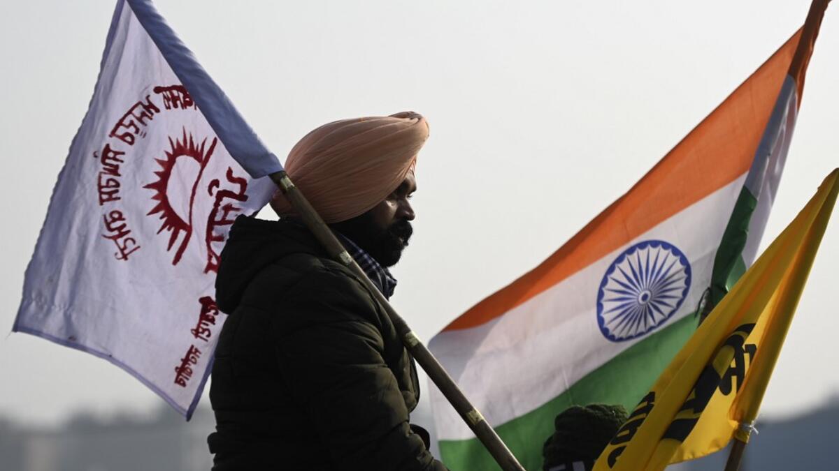 A farmer takes part in a tractor rally as they continue to demonstrate against the central government's recent agricultural reforms in New Delhi on January 26, 2021. Money SHARMA / AFP