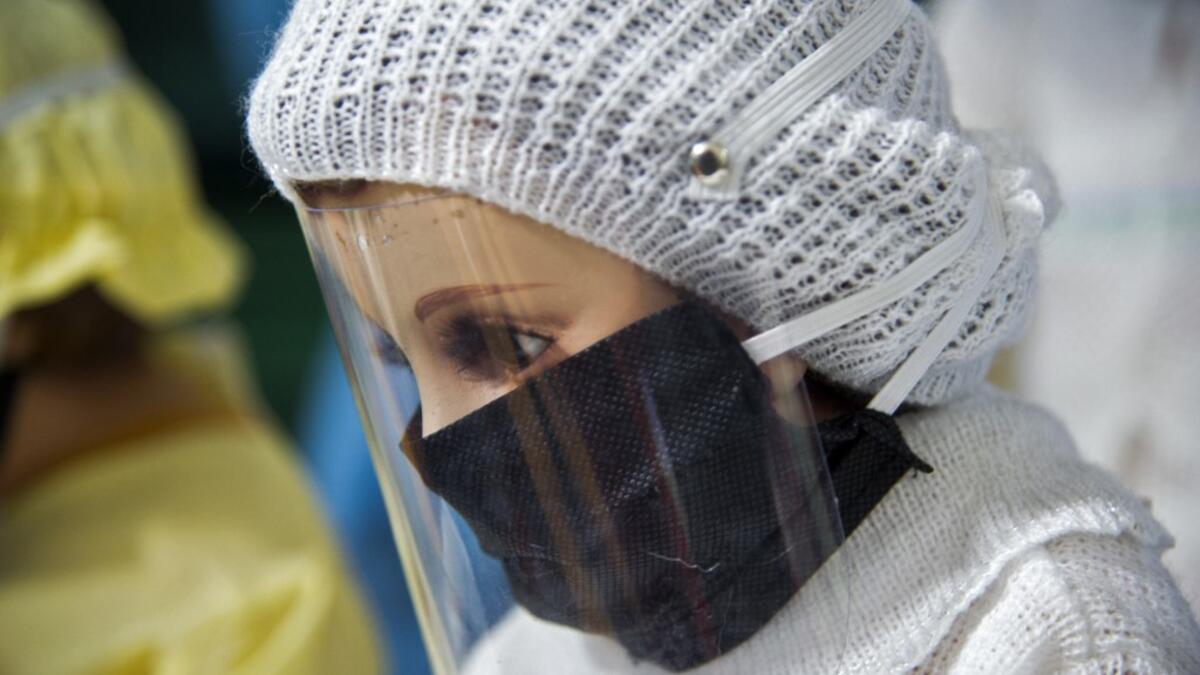 View of a doll displayed for sale at the ¨Nino Uribe¨ traditional Mexican store in Mexico City on January 27, 2021. ¨Nino Uribe¨ sells representations of the Baby Jesus called Baby COVID to raise awareness on the preventive measures to take amid the COVID-19 coronavirus pandemic. CLAUDIO CRUZ / AFP