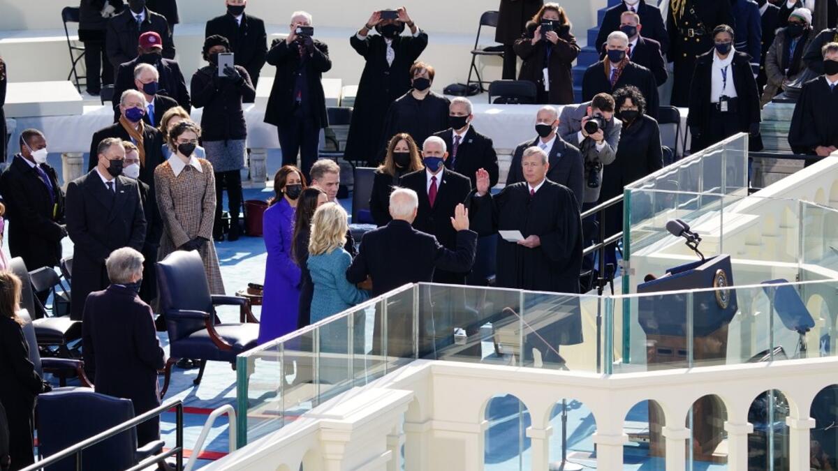 John Roberts, chief justice of the U.S. Supreme Court, center right, administers the oath of office to U..S. President-elect Joe Biden,during the inauguration on the West Front of the U.S. Capitol on January 20, 2021 in Washington, DC. During today's inauguration ceremony Joe Biden becomes the 46th president of the United States. Kevin Dietsch-Pool/Getty Images/AFP
